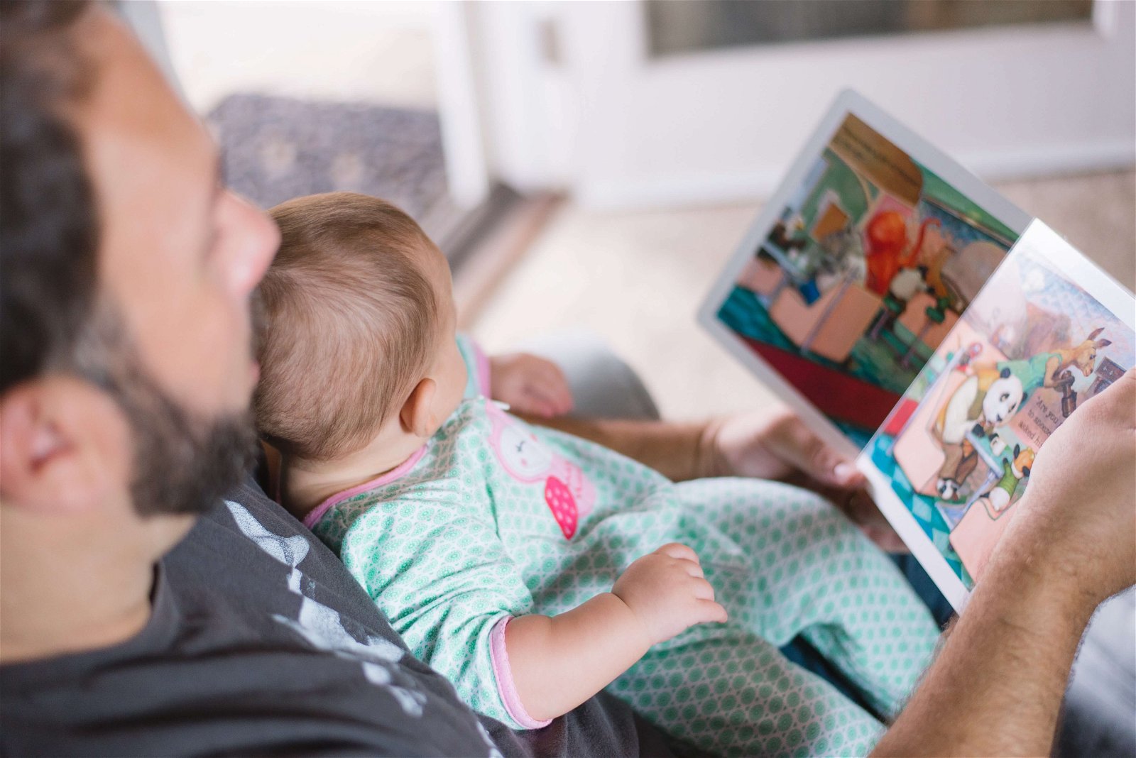 Dad reading with baby